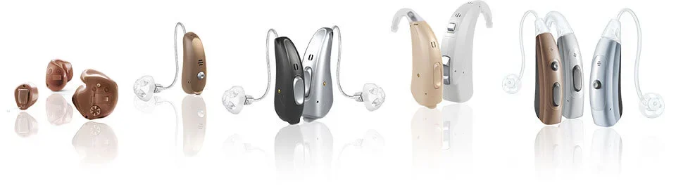 A selection of modern in-ear and behind-the-ear hearing aids